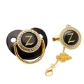 Close-up of black and gold baby pacifier with letter Z and sparkling rhinestones - Letter Z