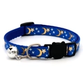 Macro detail of blue nylon pet collar featuring gold moon patterns and a silver bell - Royal Blue