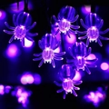 Close-up of purple LED spider fairy lights with glowing bokeh background for Halloween - Purple Spider / 1.5m 10 LEDs Battery Operated