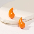 Chic orange teardrop stud earrings with a glossy finish on a minimalist stone base - Orange