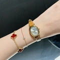 Women's quartz watch with oval gold dial and brown leather strap and clover bracelet - Leather Strap / Gold Case/Caramel Strap