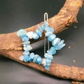 Close-up of wire-wrapped pentagram hair clip with blue natural crystal stones - Aquamarine Star Hair Clip