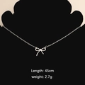 Silver bow pendant necklace in stainless steel on black display with 45cm length specs - Bow 2 Necklace (Steel Color)