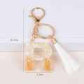 Detail of R-letter keychain with resin gold foil and white tassel, 10.5cm height size - Letter R