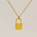 Minimalist gold padlock necklace featuring an engraved letter G on an O-chain link - Letter G Style