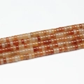 Close-up of natural orange stone spacer square beads for DIY necklace jewelry making - 3x6mm (110pcs) / Red Aventurine