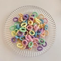 Elastic hair ties in vibrant macaron colors including pink, purple, and blue tones - Macaron Color 100Pcs OPP Bag
