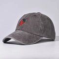 Detail of a vintage washed charcoal grey baseball cap with a red strawberry embroidery. - Adjustable / Strawberry Coffee