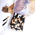 Macro detail of double-sided disposable eye shadow brushes in a clear plastic box - 4.7cm Single Head Black Handle Skin White Sponge - 50 Pcs Box
