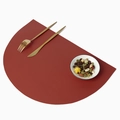 Nordic reddish brown semi-circle leather placemat with lychee texture and golden cutlery - Burgundy