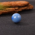 Polished 20mm blue crystal ball made of natural stone placed on a wood texture surface - 20*20mm / Blue Aventurine