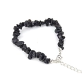 Macro detail of natural black irregular crystal stones with adjustable silver clasp - Obsidian
