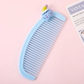 Mini crescent hair comb in light blue plastic with a cute cartoon star character - Star with Hat
