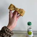 Eleganter senfgelber Satin-Schleifen-Haarclip mit raffiniertem Federverschluss - Ingwergelb