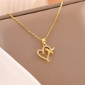 Collana a cuore con farfalla in oro 18 carati e zirconi pavé su una catena sottile - Collana a Cuore e Farfalla in Oro 18K
