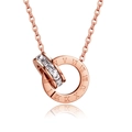 Macro shot of rose gold double interlocking rings with Roman numerals and cubic zirconia - Roman Double Ring Necklace / Rose Gold