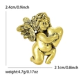 Vintage golden alloy angel brooch holding a heart with size and weight dimensions - Antique Gold