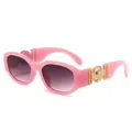 Pink retro rectangle sunglasses with large gold metal medusa medallion on temples - Transparent Pink Frame Gradient Grey Lenses