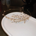 Close-up of golden branch leaf headband with sparkling rhinestones and crystal details - Golden Willow