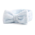 Gedetailleerd zicht op een lichtblauwe koraalvlies hoofdband met grote pluche strik - Blauw