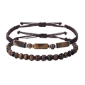 Detailed view of handmade tiger eye stone beaded bracelets with woven cords and metal spacers - Two-Piece Set / Tiger's Eye