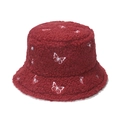 Detail of dark red faux shearling bucket hat featuring white butterfly embroidery - Burgundy