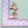 Detail view of cherry pendants with gold alloy leaves and pink cat-eye beads for DIY jewelry - Style 52