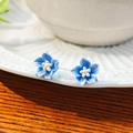Elegant 3D blue flower stud earrings with gradient petals and delicate white stamens - 3D Blue Flower Studs