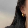 Elegant gold triple layer hoop earrings featuring a minimalist multi-ring metal design - Gold Triple Hoop Earrings