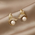 Detail of elegant gold fishtail earrings with sparkling zircons and white pearls - #7 Micro-painted Fishtail Pearl Stud Earrings