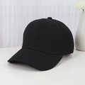 Simple minimalist black cotton baseball cap on a white table with clean background - Adjustable / Black
