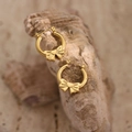 Polished golden stainless steel hoop earrings with elegant bow detail on natural stone surface - EH373-Bowknot Hoop
