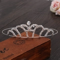 Macro shot of silver princess crown headband with rhinestones on a wooden vintage box - Style 4 (Scroll Heart-Silver)