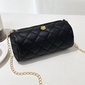 Black quilted cylinder bag with gold chain strap and camellia flower ornament - Black