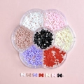 Bow tie nail art charms and pearls in a floral storage box with various colors - Plum Box B13-Multicolor Classic Bowknots and Artificial Pearls