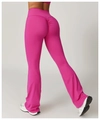 Detail showing the high-waisted scrunch butt design on rose pink yoga flare pants - S / Bottoms / Magenta