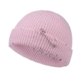 Detail of pink distressed knit beanie with metal safety pin and silver rings accessory - 55-58cm / Pink