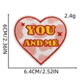 Macro detail of heart embroidery patch with YOU AND ME lettering and red star accents - Heart 8# (YOU AND ME)