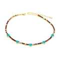 Detail of rainbow zircon gold necklace featuring five turquoise enamel heart pendants - Blue Heart: Colorful Zircon
