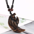 Ethnic style turtle shell resin pendant necklace with black braided cord and wooden beads - Wolf Head / Dark Brown