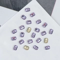 Sparkling purple and gold K9 rectangular nail art rhinestones on a white surface - Rectangle Octagon 6x8mm