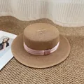 Classic straw boater hat in brown with an elegant pink satin ribbon and flat top design - M / Khaki with Pink Bow