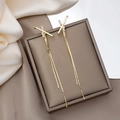Elegant gold-tone long tassel earrings featuring X-shape zircon studs on a velvet gift box - Cross Shape Zircon Tassel (E3966)