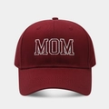 Close-up of white MOM embroidery on a burgundy cotton baseball cap with fine texture - New MOM Style / Burgundy