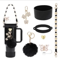 Detail view of black silicone tumbler accessories with daisy strap and butterfly charms - 7-Piece Set 2-Black Butterfly