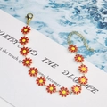 Golden bracelet with red enamel daisy flower charms and adjustable lobster clasp - Large Flower Bracelet / Red