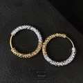 Detail view of gold and silver contrast hoop earrings with unique lava texture on leather - Hoop Ear Buckle / Gold & Silver Two-Tone Textured