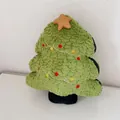 Close-up of plush Christmas tree pillow with soft textures and decorative star - Star Christmas Tree