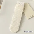 Elegant white leaf-patterned JK socks with ruffled edges and breathable mesh texture - With Cardboard / White Leaf