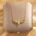 Elegant gold antler necklace with a sparkling heart-shaped crystal pendant - Antlers